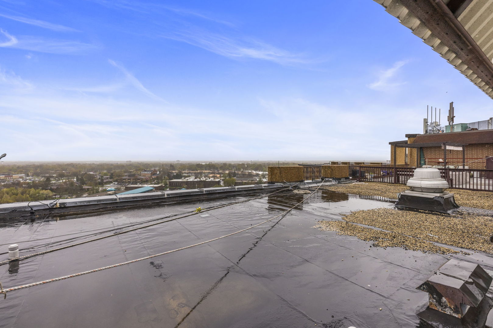 1 Renaissance Place, Unit PH2 Palatine, IL 60067 - Photo 19 of 23 a view of a terrace with lawn chairs & wooden fence