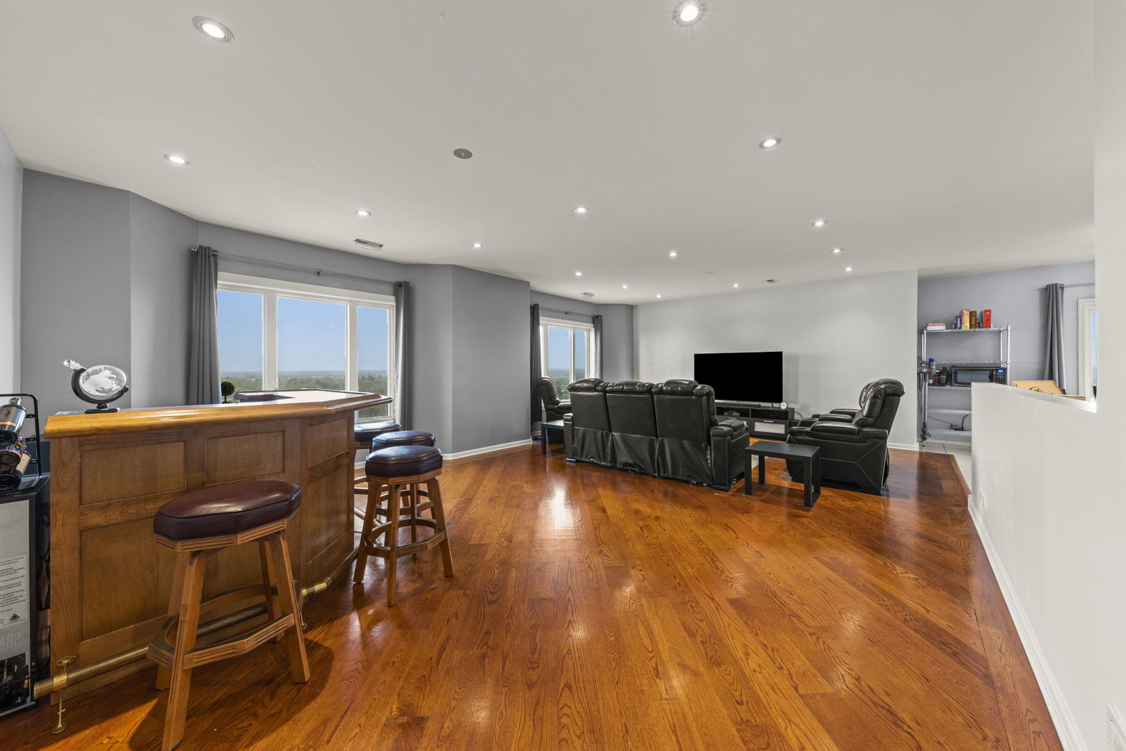 1 Renaissance Place, Unit PH2 Palatine, IL 60067 - Photo 4 of 23 a living room with furniture a flat screen tv and kitchen view