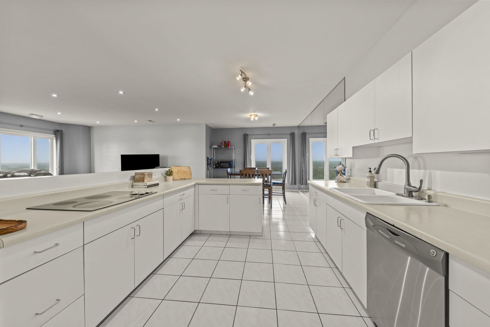 1 Renaissance Place, Unit PH2 Palatine, IL 60067 - Photo 10 of 23 a large white kitchen with a sink and cabinets