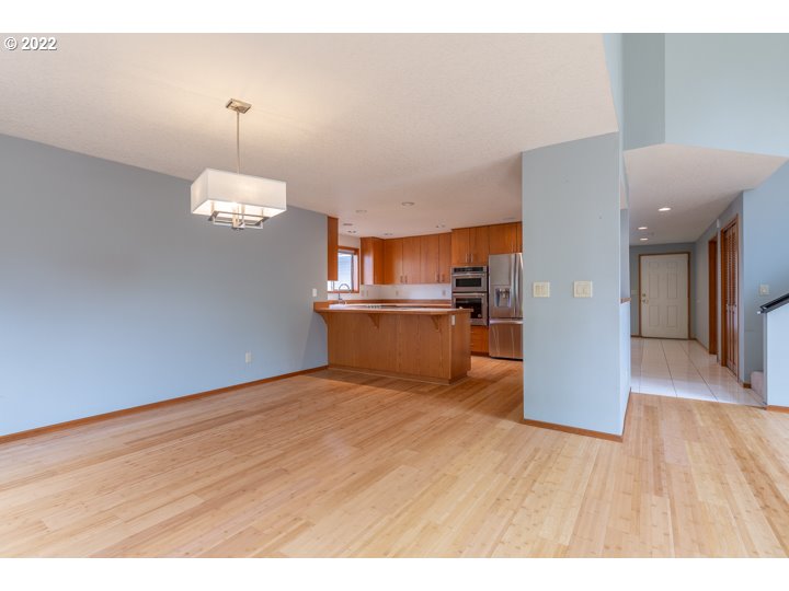 15917 Northeast Union Road, Unit 29 Ridgefield, WA 98642 - Photo 9 of 31 a view of a kitchen with cabinets and wooden floor