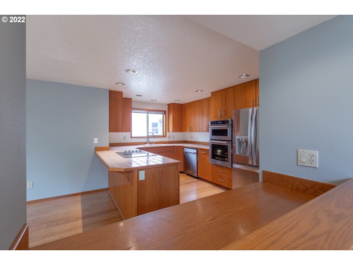 15917 Northeast Union Road, Unit 29 Ridgefield, WA 98642 - Photo 10 of 31 a view of kitchen with stainless steel appliances cabinets