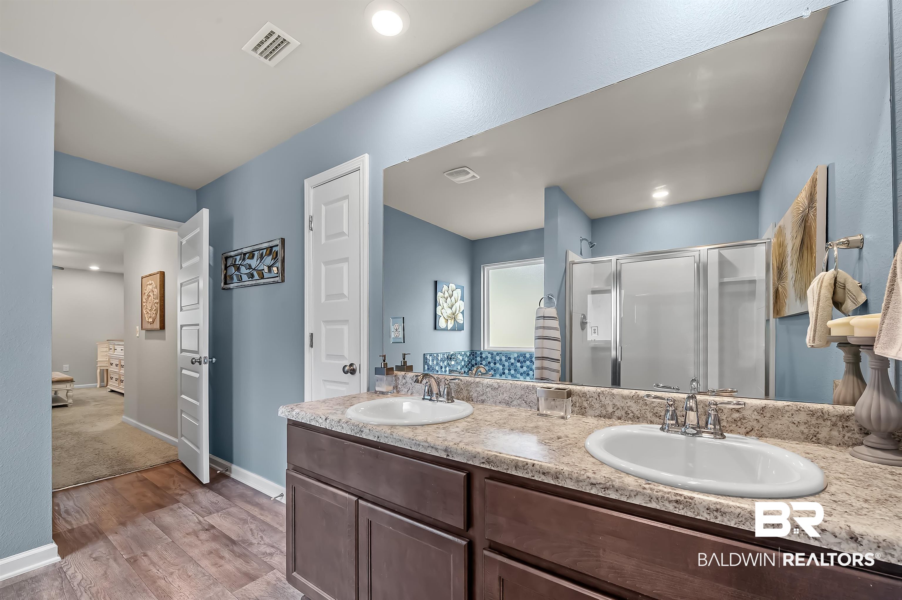 17985 Lewis Smith Drive Foley, AL 36535 - Photo 30 of 56 Bathroom with wood-type flooring, an enclosed shower, and vanity