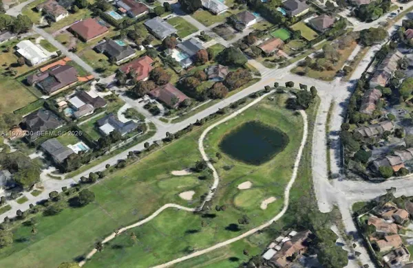 an aerial view of a residential houses with outdoor space