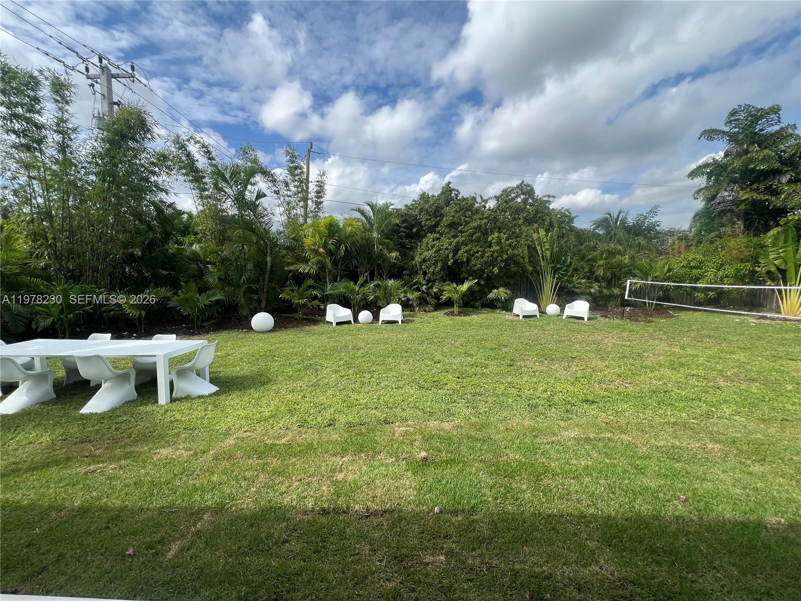9151-sw 128 St Miami, FL 33176 - Photo 8 of 13 a view of a house with a yard and sitting area