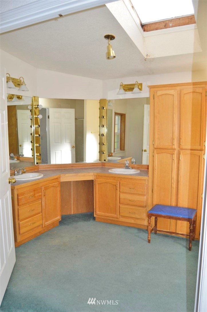 120 Bowers Road Chehalis, WA 98532 - Photo 18 of 31 a bathroom with a granite countertop sink and a mirror