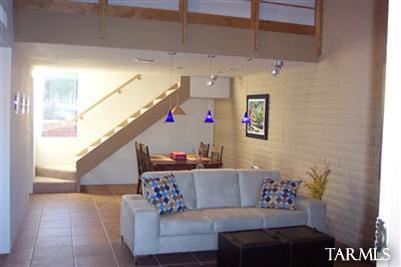 4318 East Allison Road Tucson, AZ 85712 - Photo 1 of 10 a living room with furniture and stairs