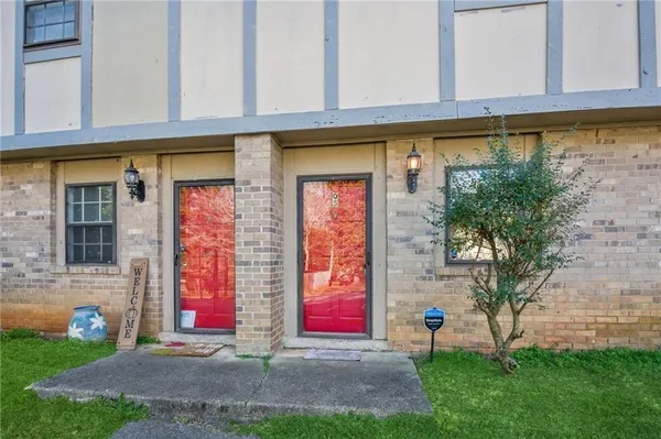 front view of a building with a yard