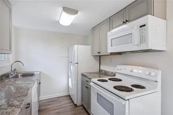 a kitchen with a stove and a microwave
