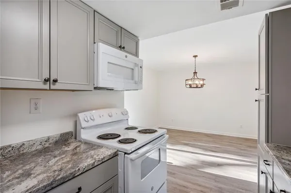 a view of a storage and utility room with washer and dryer
