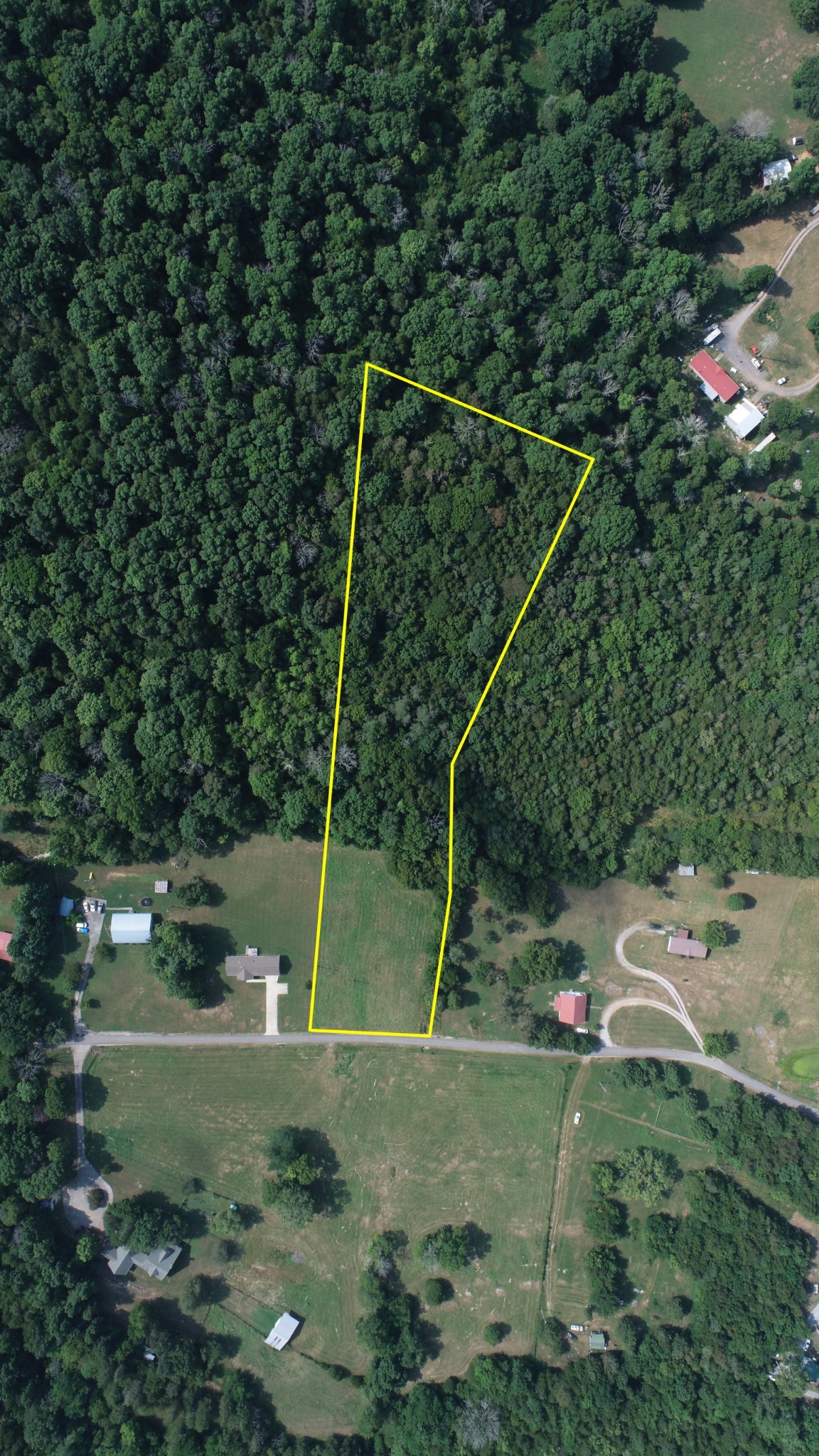 0 McClanahan Road Hartsville, TN 37074 - Photo 2 of 11 a backyard of a house with lots of green space