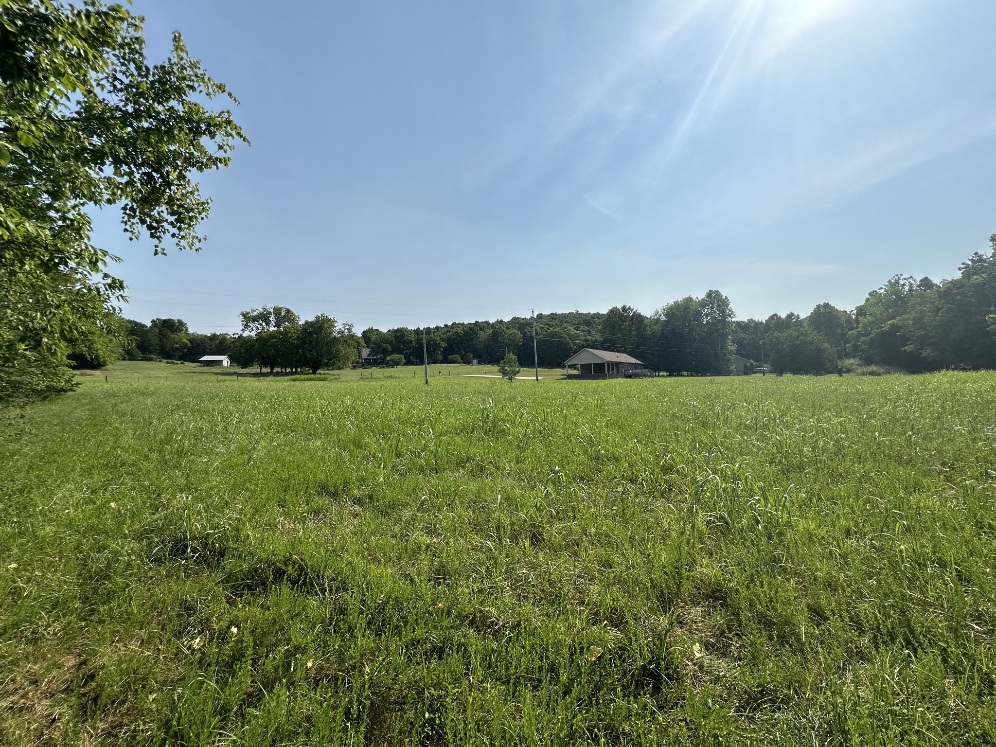 0 McClanahan Road Hartsville, TN 37074 - Photo 5 of 11 a view of a green field with wooden fence
