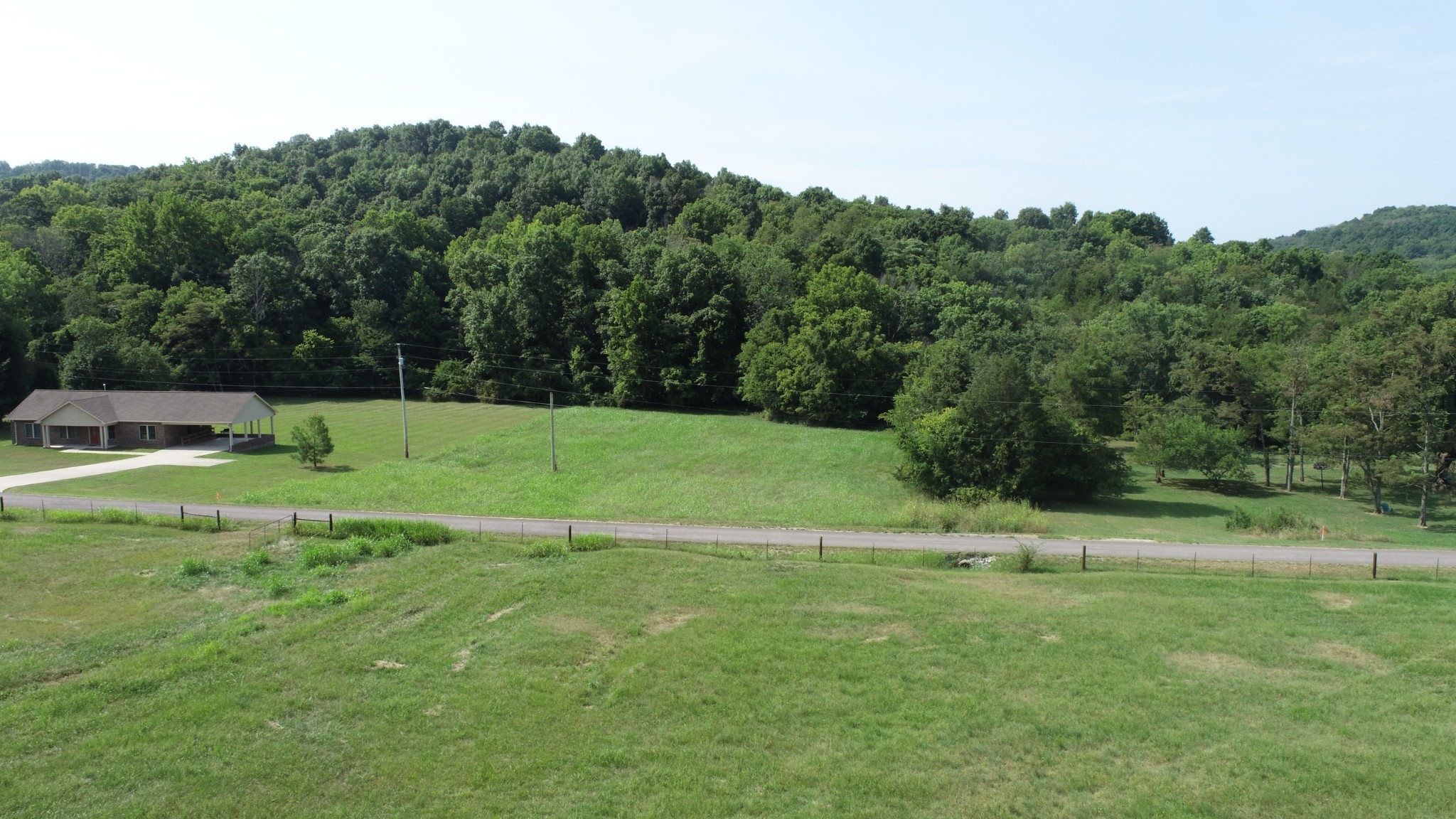 0 McClanahan Road Hartsville, TN 37074 - Photo 9 of 11 a view of a grassy field