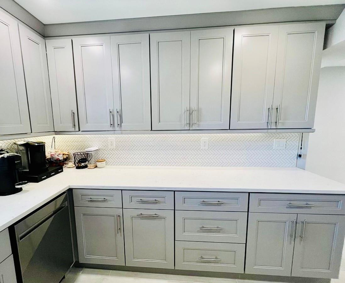 9235 Southwest 8th Street, Unit 207 Boca Raton, FL 33428 - Photo 15 of 24 a kitchen with a sink and cabinets