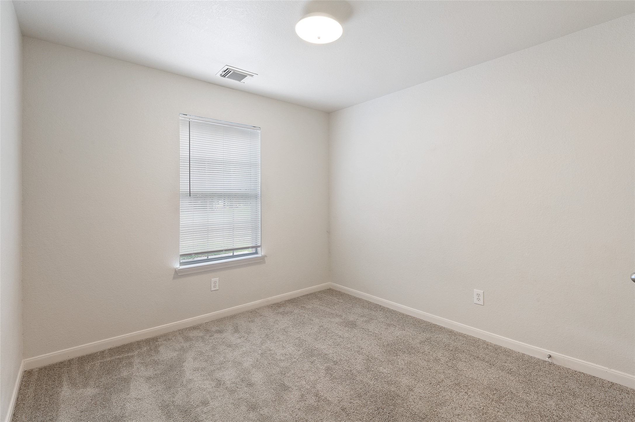 29522 Legends Stone Drive Spring, TX 77386 - Photo 9 of 17 an empty room with windows