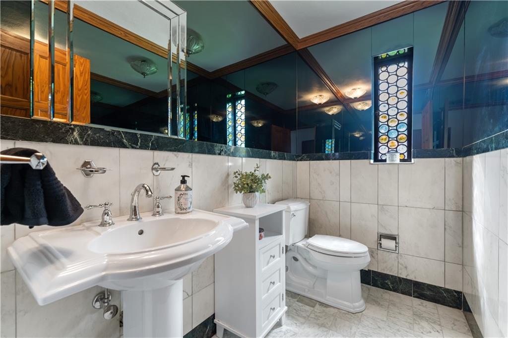 840 Osage Road Pittsburgh, PA 15243 - Photo 11 of 47 a bathroom with a sink a toilet and mirror