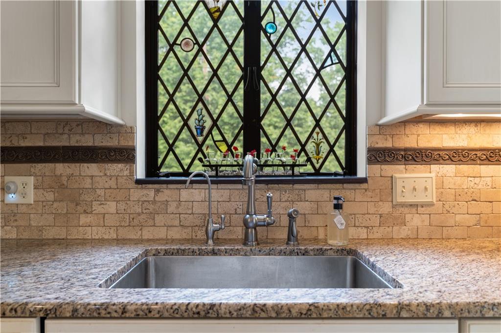 840 Osage Road Pittsburgh, PA 15243 - Photo 19 of 47 a kitchen with a sink and a granite countertop next to a window