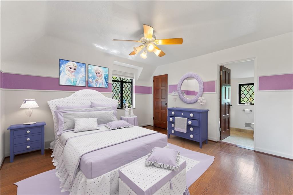 840 Osage Road Pittsburgh, PA 15243 - Photo 26 of 47 a bedroom with a bed and wooden floor