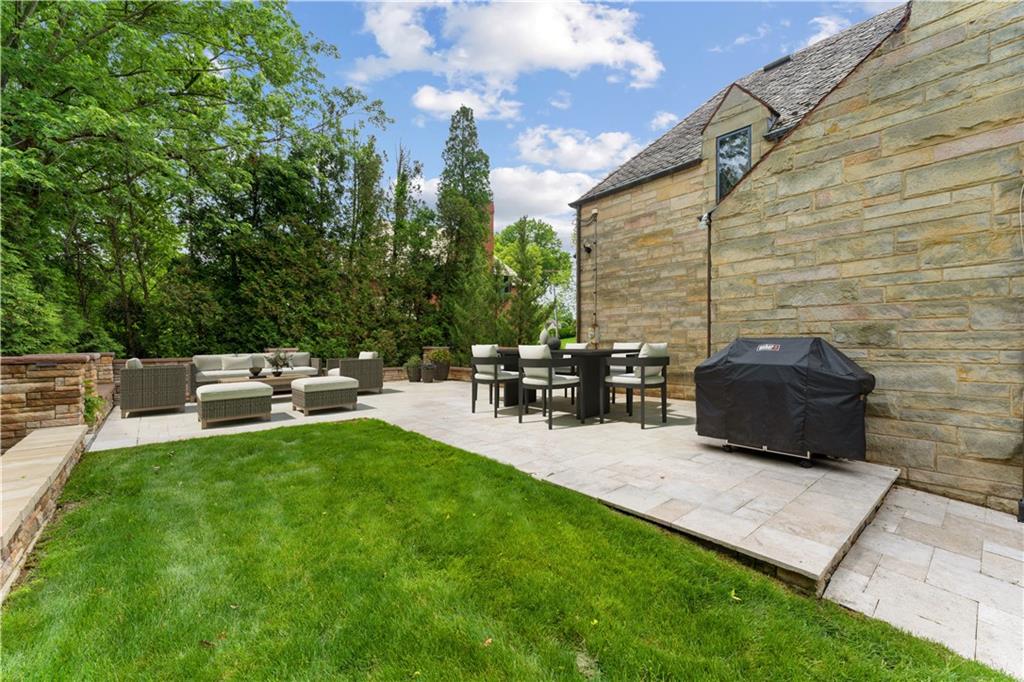 840 Osage Road Pittsburgh, PA 15243 - Photo 37 of 47 a backyard view of a house with fire pit and chairs