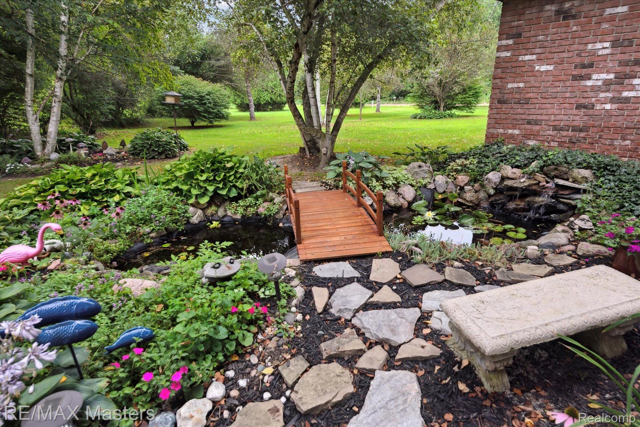 21610 Otter Road Belleville, MI 48111 - Photo 23 of 35 Pond With Bridge