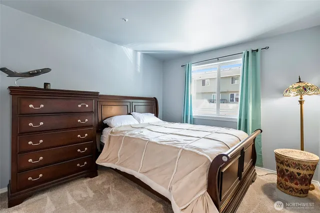 a bedroom with a bed and a dresser