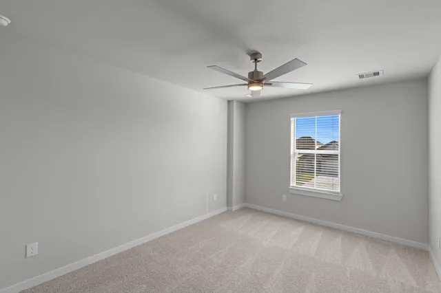 an empty room with closet area