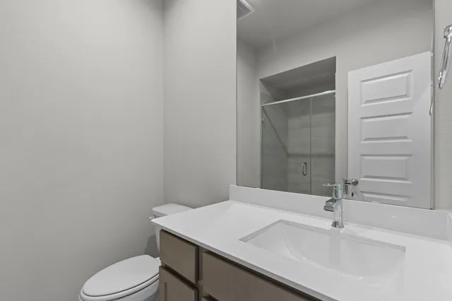 a bedroom with bed and a chandelier