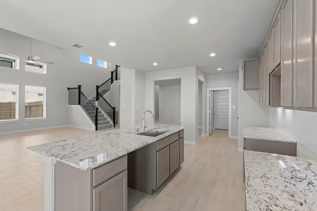 a kitchen with a table and chairs in it