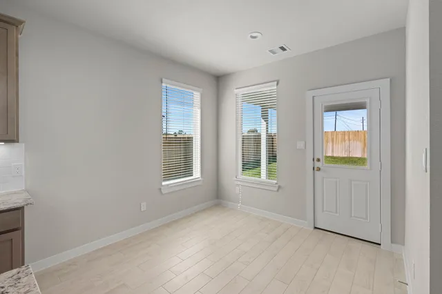 a view of a kitchen with furniture and a kitchen
