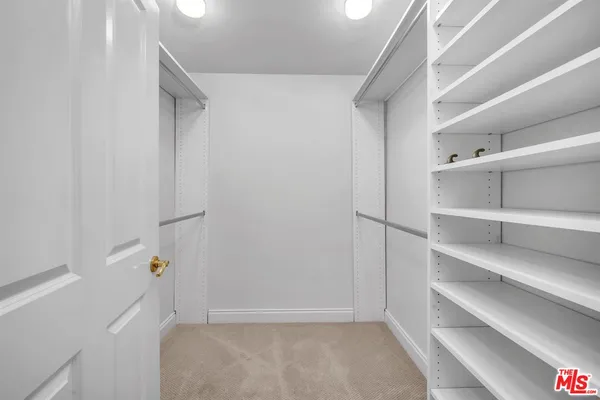 a view of an empty walk in closet