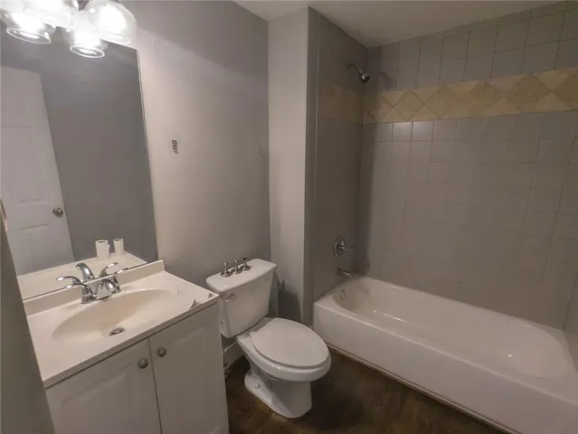 a view of balcony with wooden floor and fence