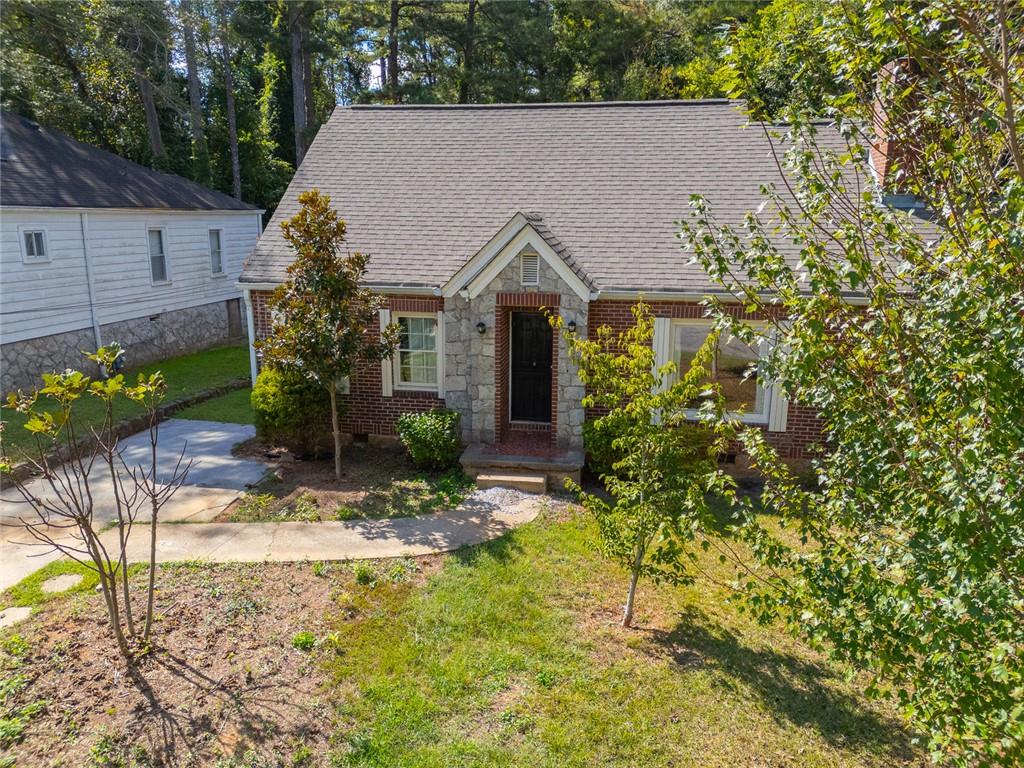 1261 Eastridge Road Southwest Atlanta, GA 30311 - Photo 3 of 36 a view of house with yard and sitting area