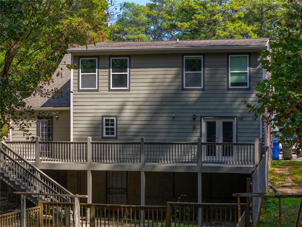 1261 Eastridge Road Southwest Atlanta, GA 30311 - Photo 35 of 36 a view of a house with a yard and potted plants