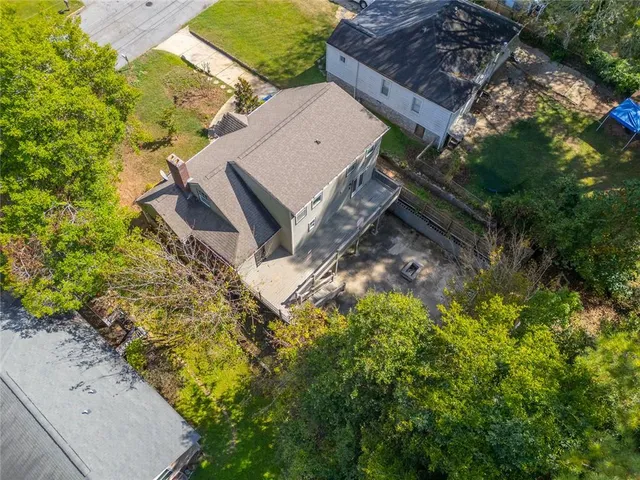an aerial view of house with yard