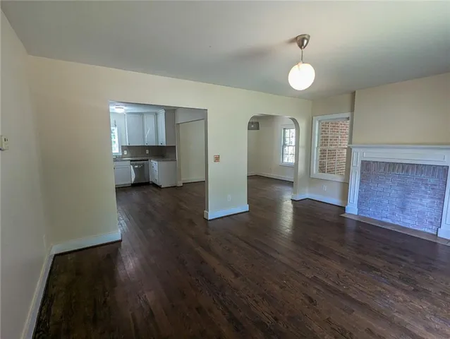 a view of a house and wooden floor
