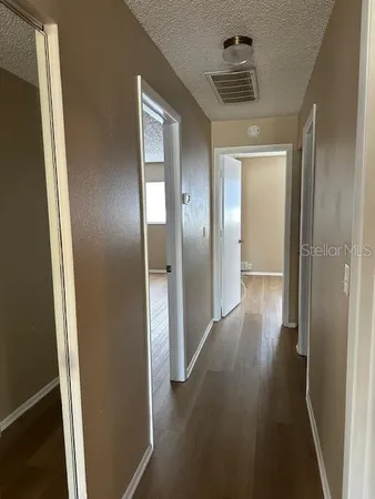a bathroom with a sink a mirror and a shower