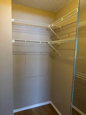 a view of a room with racks on the wall