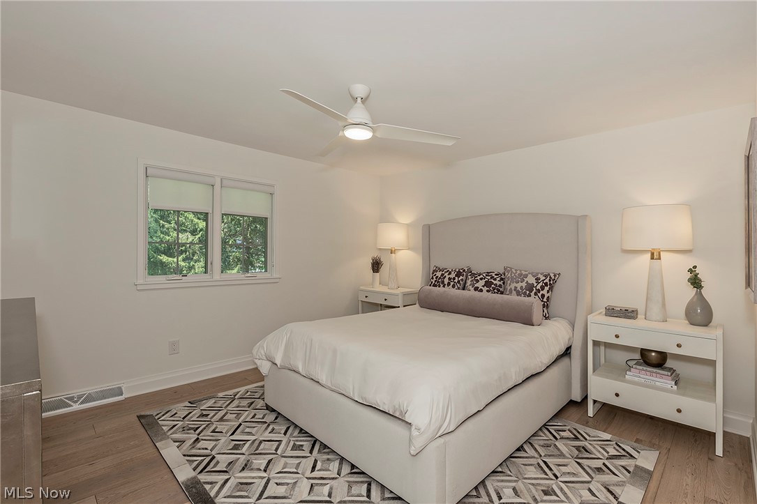 3189 Lander Road Pepper Pike, OH 44124 - Photo 30 of 43 Bedroom featuring wood-finish flooring, a contemporary ceiling fan, and white baseboards