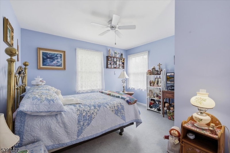 42 Copper Penny Road Flemington, NJ 08822 - Photo 29 of 39 a bedroom with a bed and a chandelier