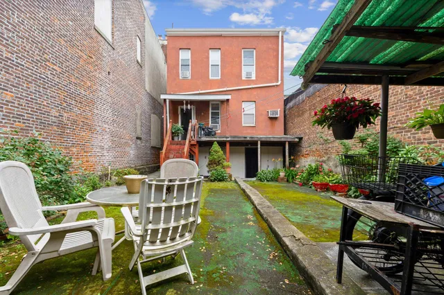 a view of a chairs and table in the patio