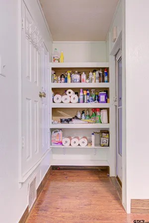 a view of water heater room with shelves