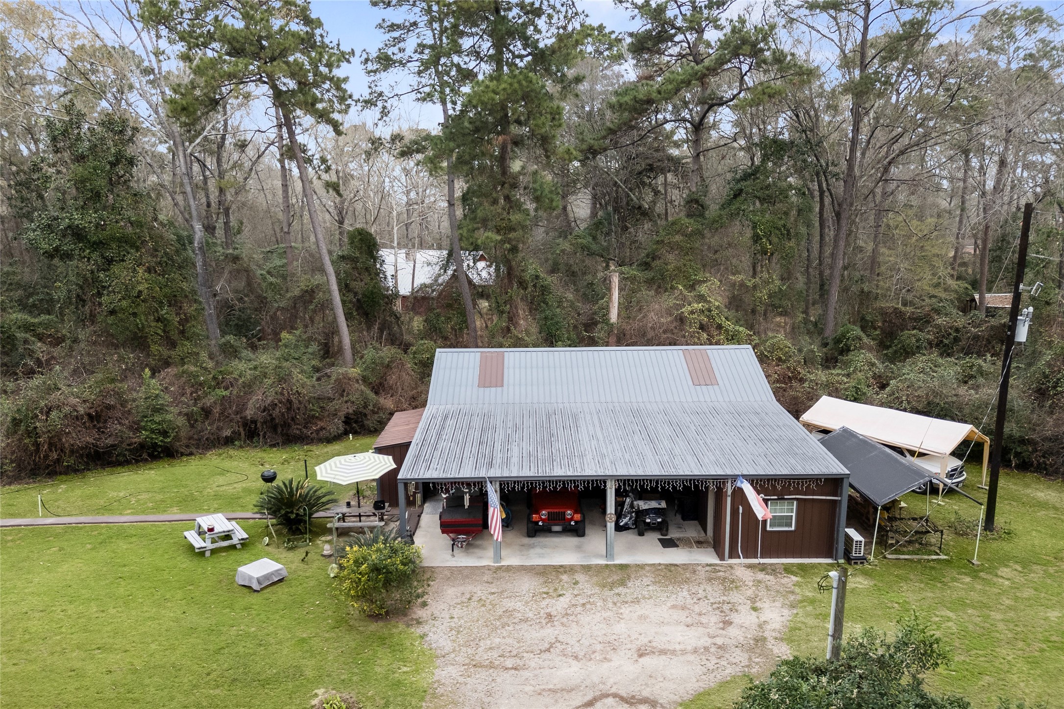 31601 Huffman Cleveland Road Huffman, TX 77336 - Photo 2 of 38 an aerial view of a house with garden space and sitting area