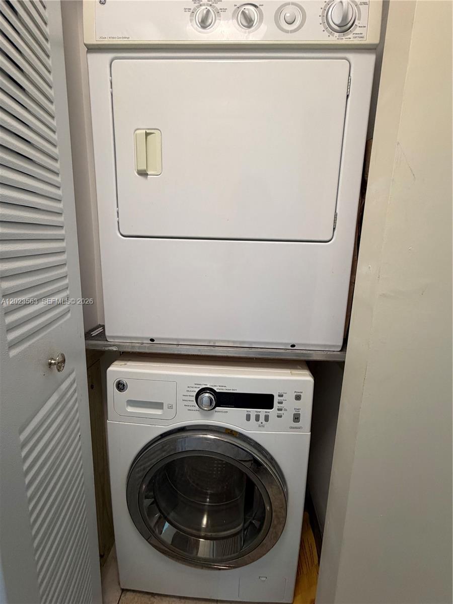 2021 Southwest 3rd Avenue, Unit 902 Miami, FL 33129 - Photo 13 of 14 a utility room with dryer and washer