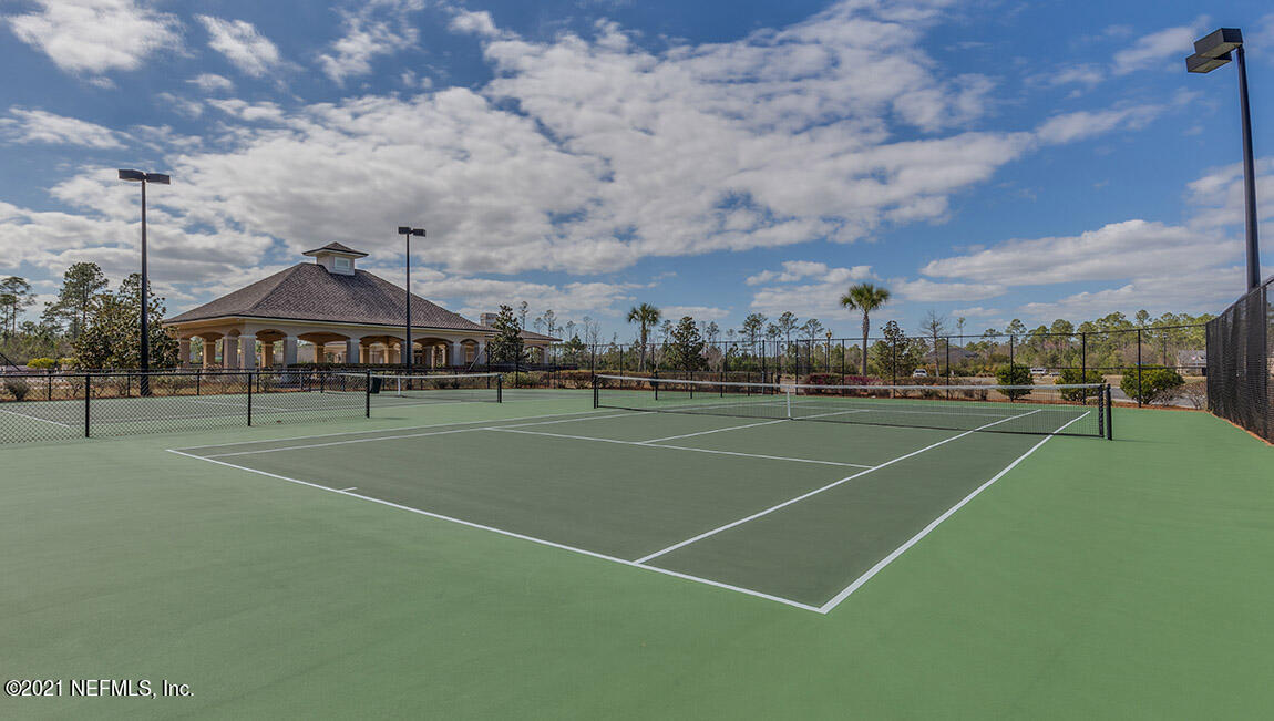 65784 Edgewater Drive Yulee, FL 32097 - Photo 25 of 44 a view of a tennis ground with large trees