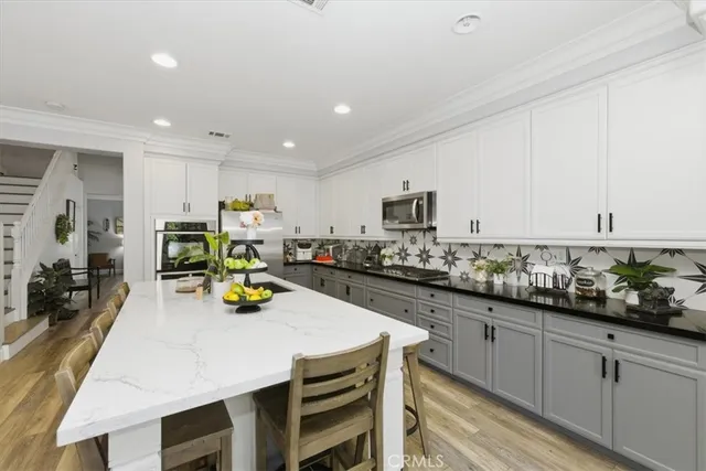 a living room with furniture flat screen tv and a fireplace