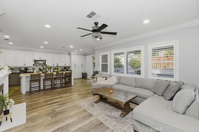 a bedroom with bed and a chandelier