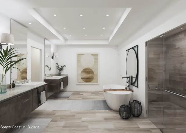 a bathroom with a double vanity sink a mirror and a bathtub