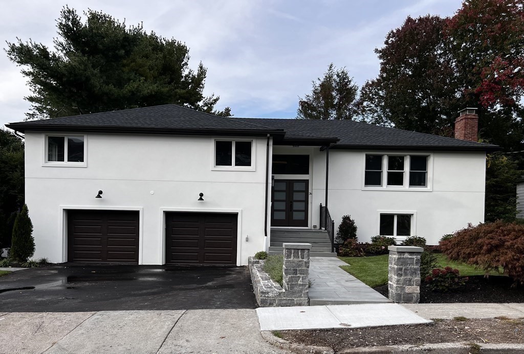 34 Donna Road, Unit 34 Newton, MA 02459 - Photo 1 of 1 a front view of a house with garden