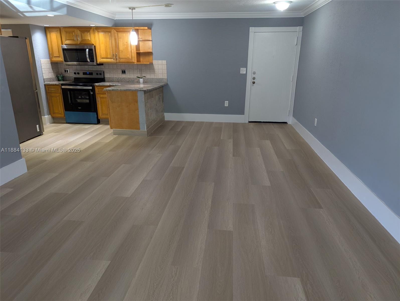 13700 Southwest 62nd Street, Unit 204 Miami, FL 33183 - Photo 1 of 30 a kitchen with stainless steel appliances a stove a sink and a refrigerator