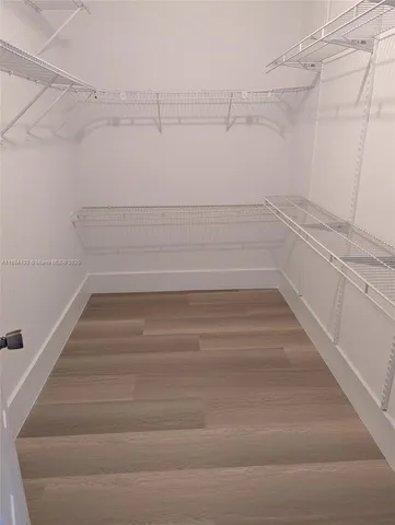 a view of a room with racks on the wall