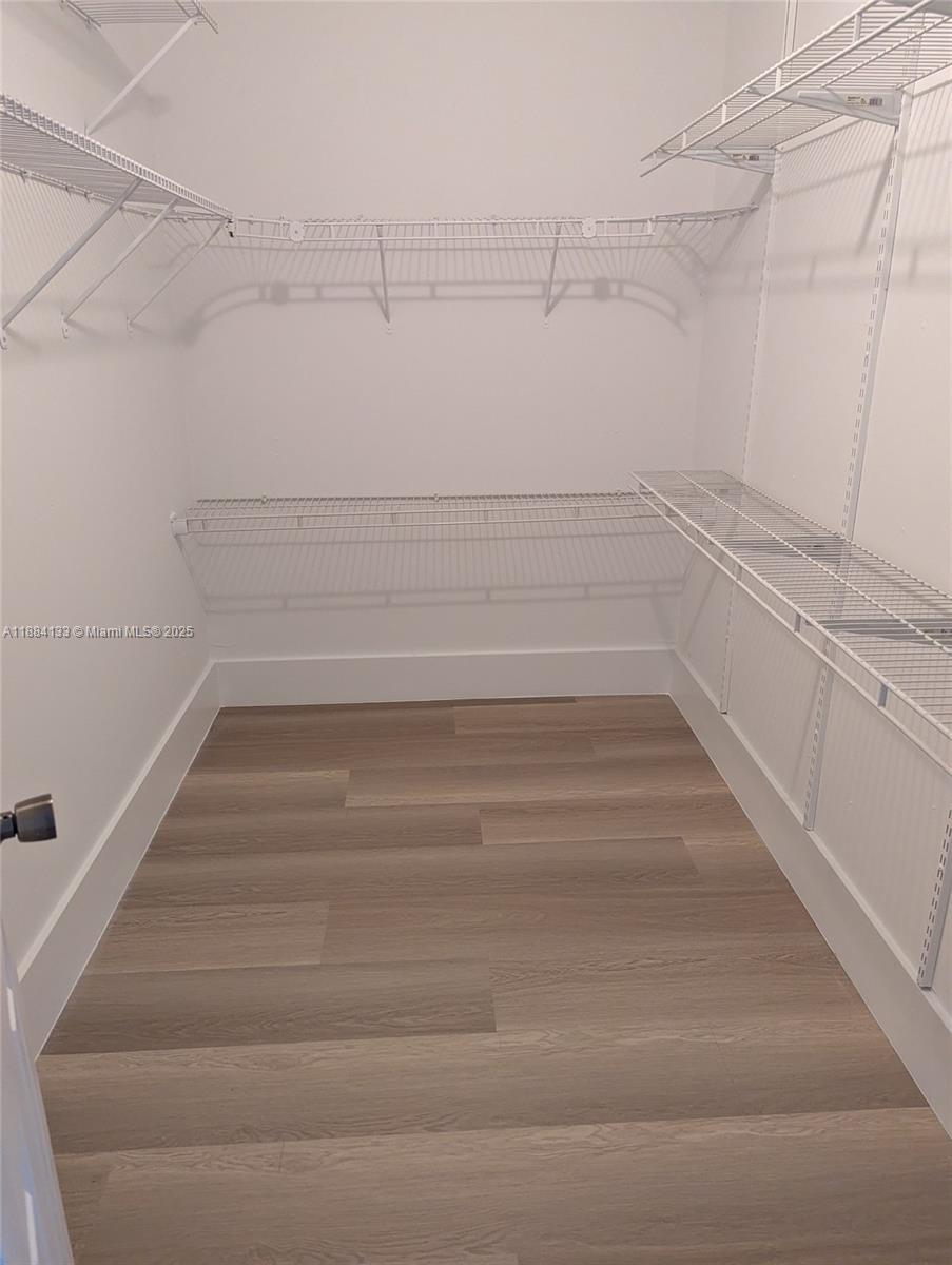 13700 Southwest 62nd Street, Unit 204 Miami, FL 33183 - Photo 17 of 30 a view of a room with racks on the wall